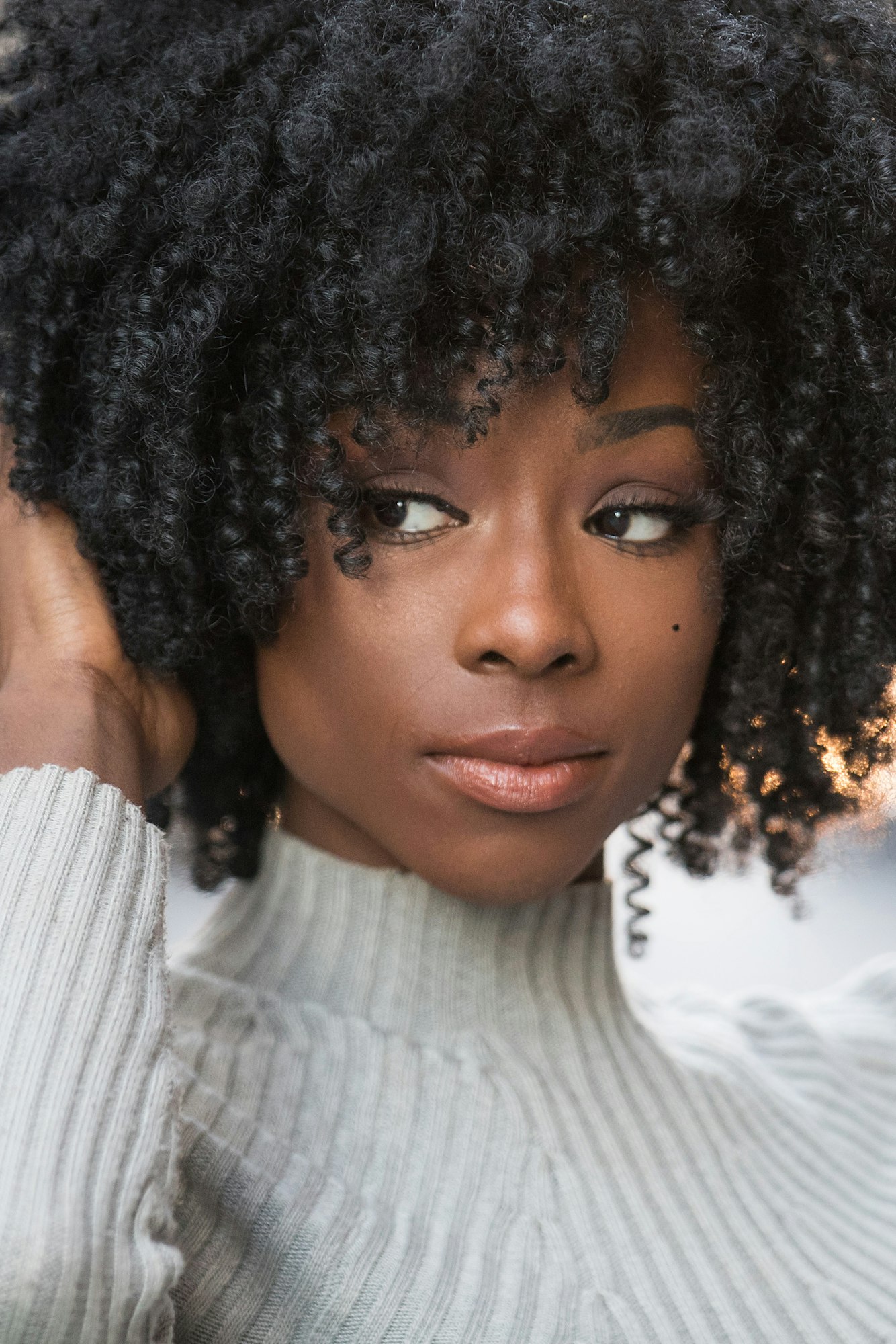 Pretty African American woman with black curly hair